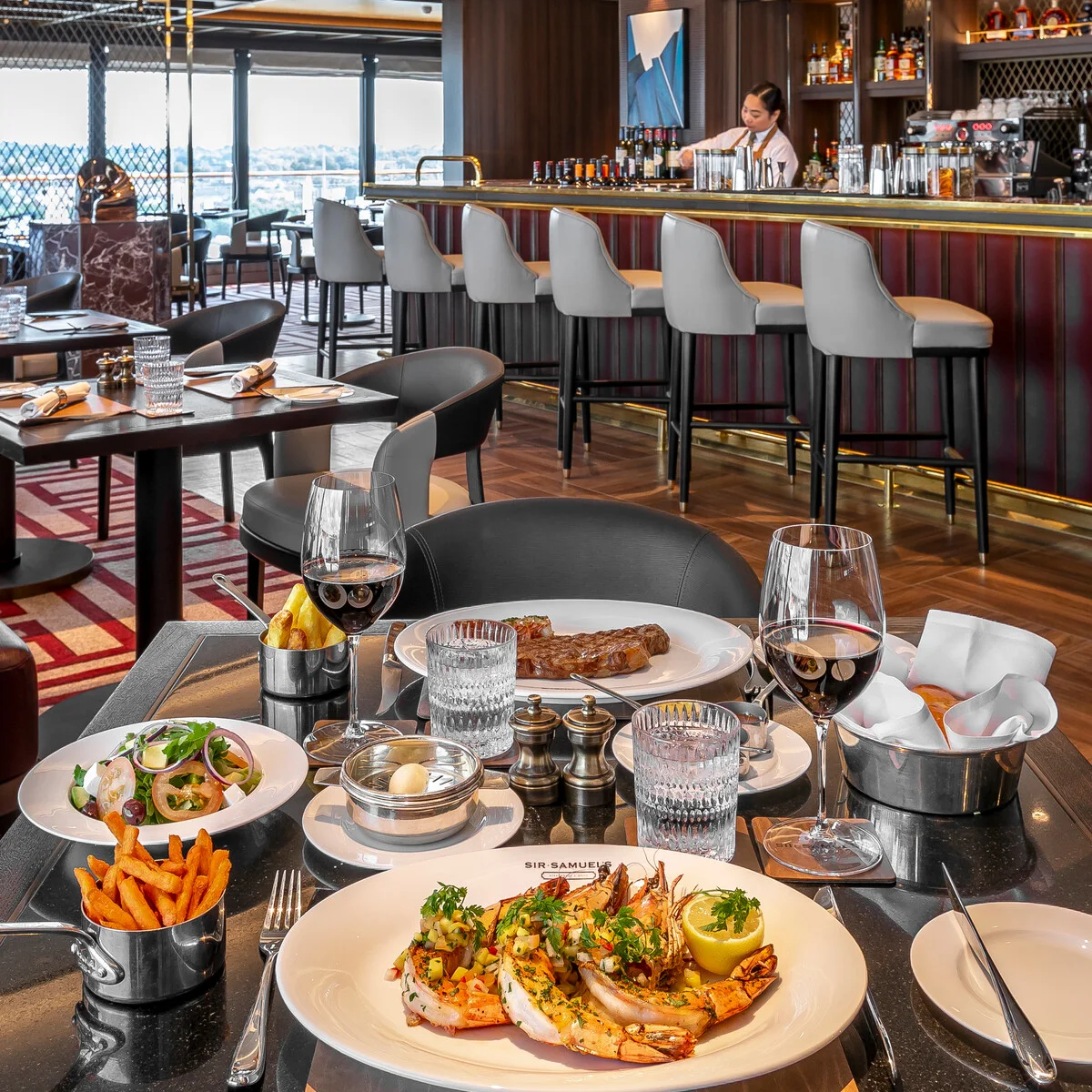 Sir Samuel's steakhouse on Cunard Queen Anne with lobster and steak and wine service
